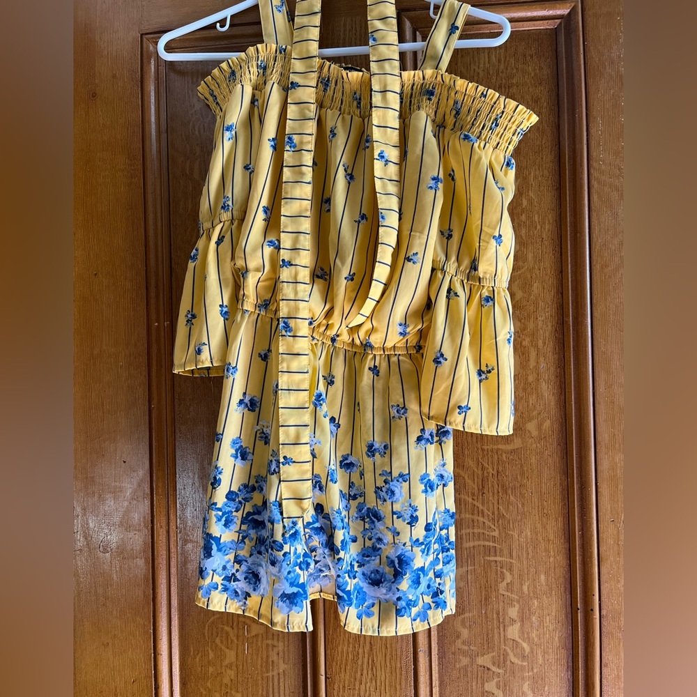Girls Yellow with blue flower romper. Size large. By My Michelle Girl